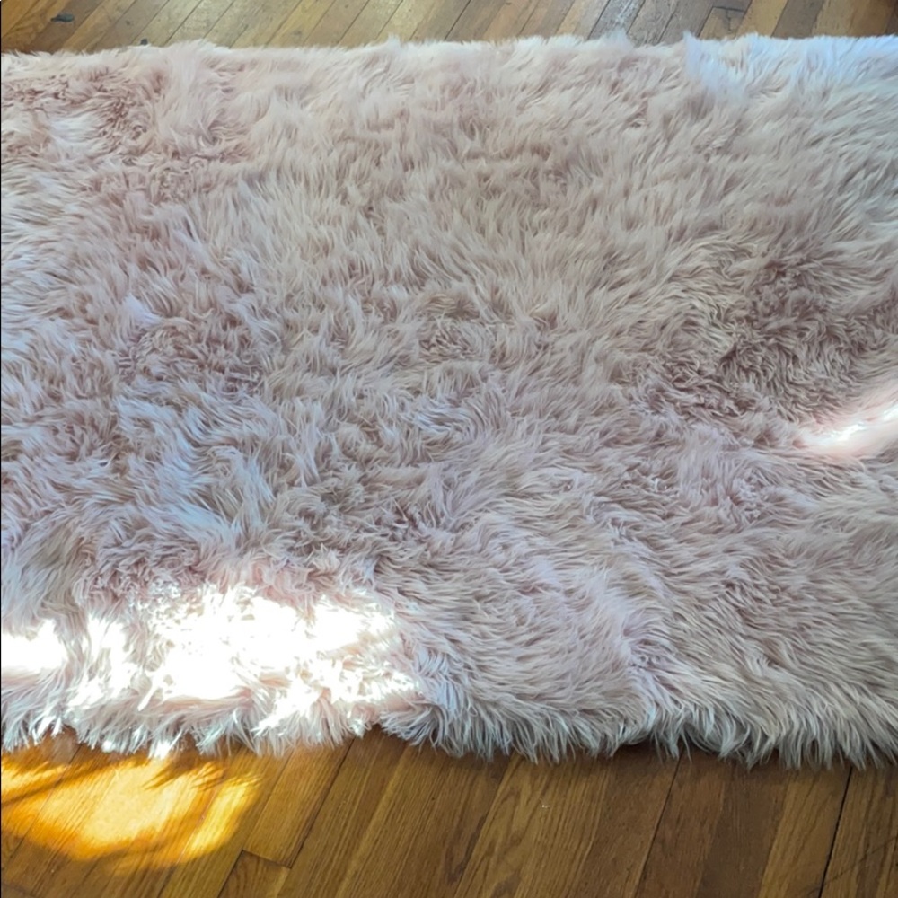 Pastel pink fluffy rug